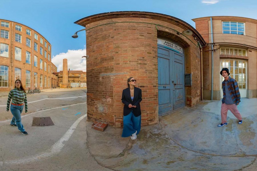 Three people standing on the street with a fish eye effect on the camera