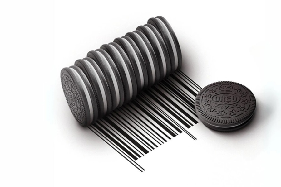 A stack of Oreos on their side being rolled to create a barcode, with a single flat Oreo next to them