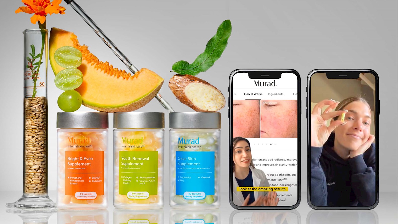  Murad product with pomegranate and papaya stacked on it, next to a vase with an orange flower in it and a pipette leaning across it and phone screens showing before and after