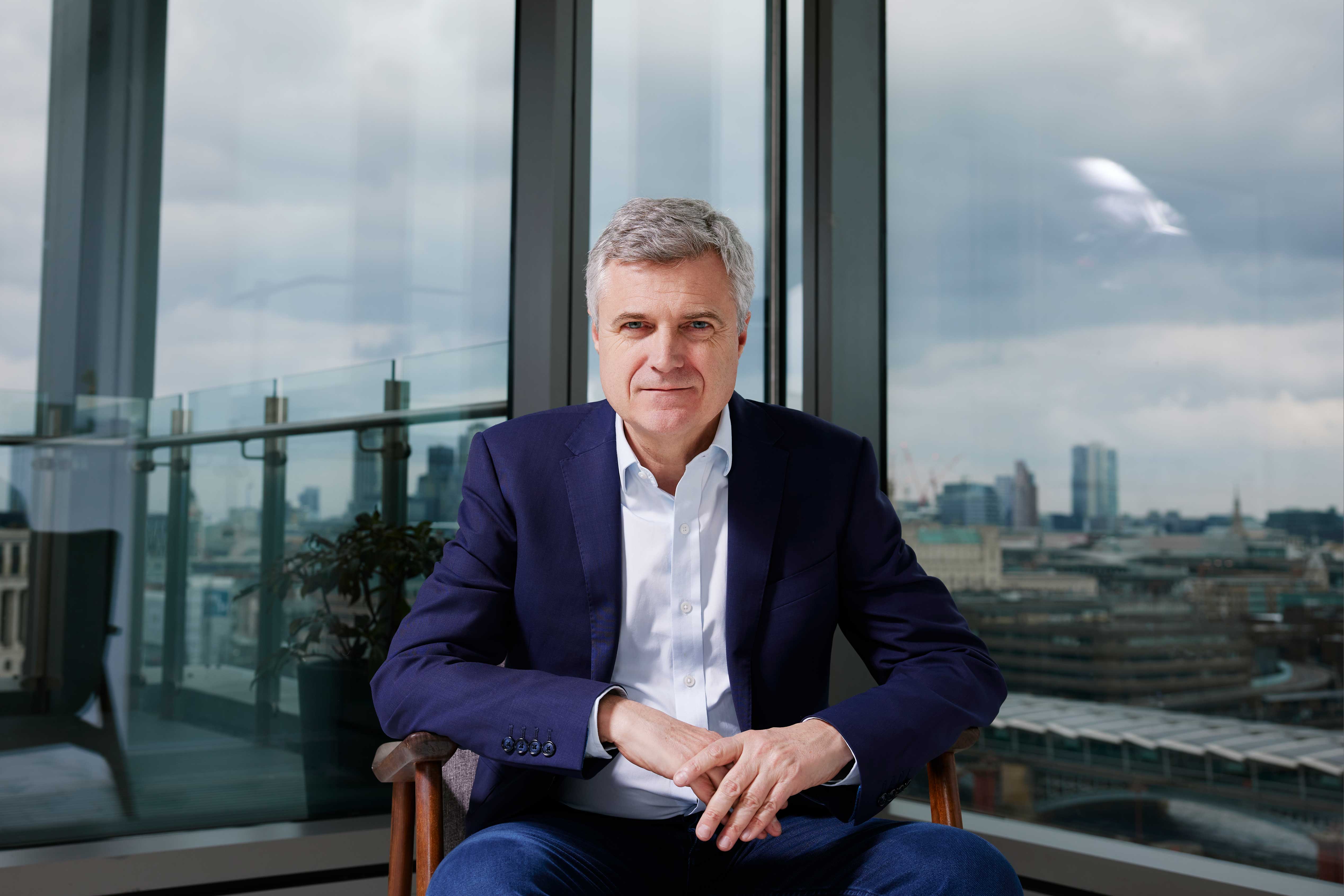 WPP CEO Mark Read sitting in front of London skyline