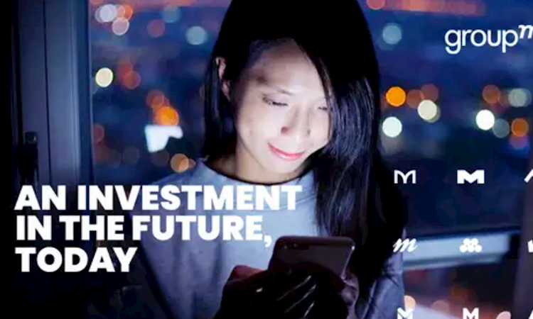 Picture of woman holding device with text "An investment in the future, today"
