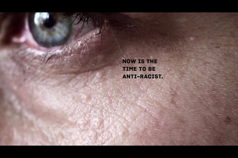Image of white man's face with words "Now is the time to be anti-racist"