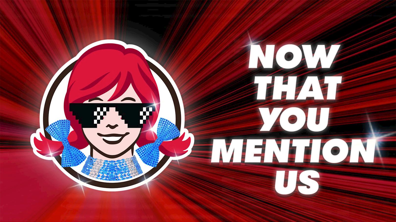 Wendy's logo with sunglasses on and text saying 'now that you mention us' 