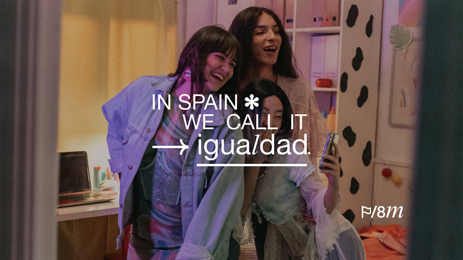 Group of girls having fun with text saying 'In In Spain we call it Equality'