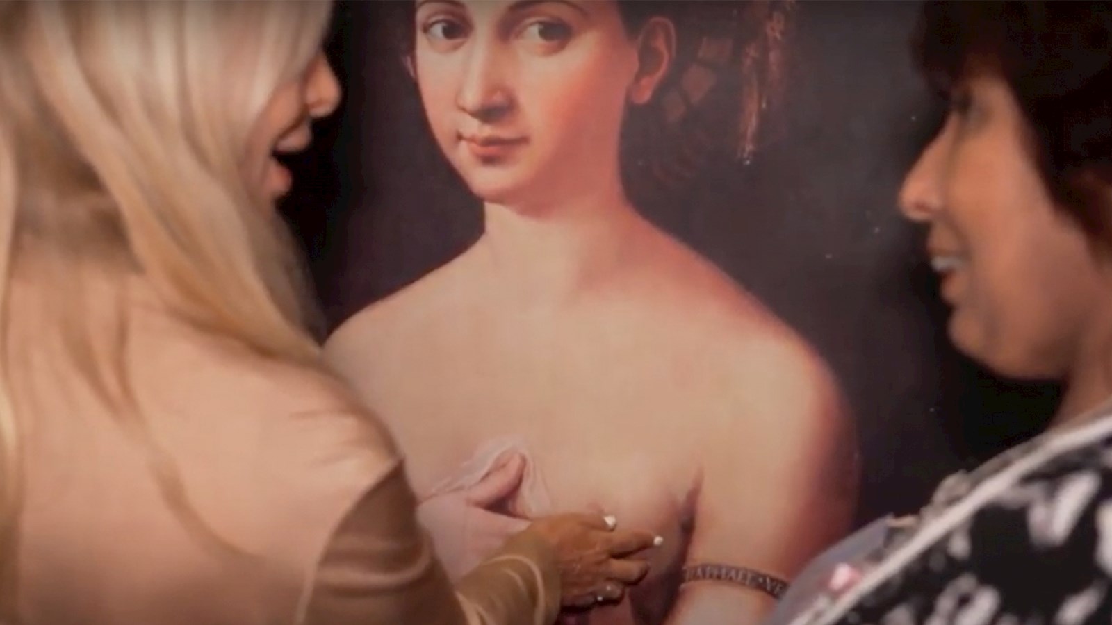People touching paintings 