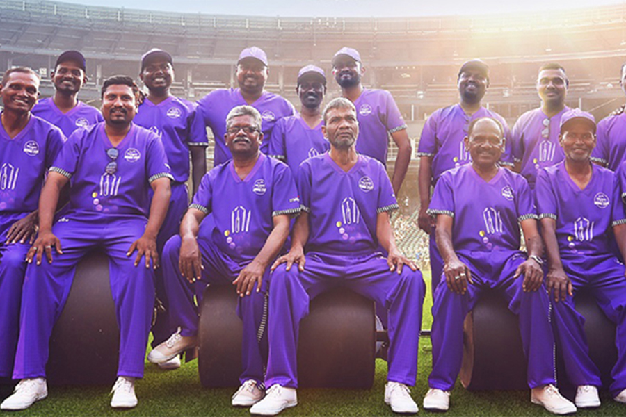 Cricket ground staff in cadbury sponsored uniforms 