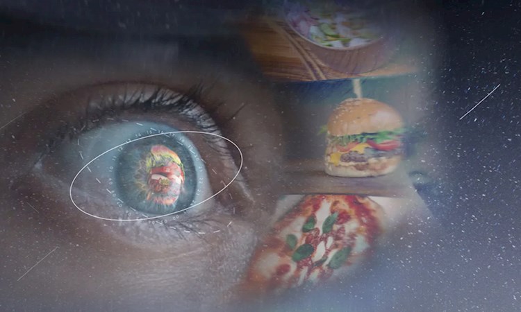 An eye looking at a universe filled with food