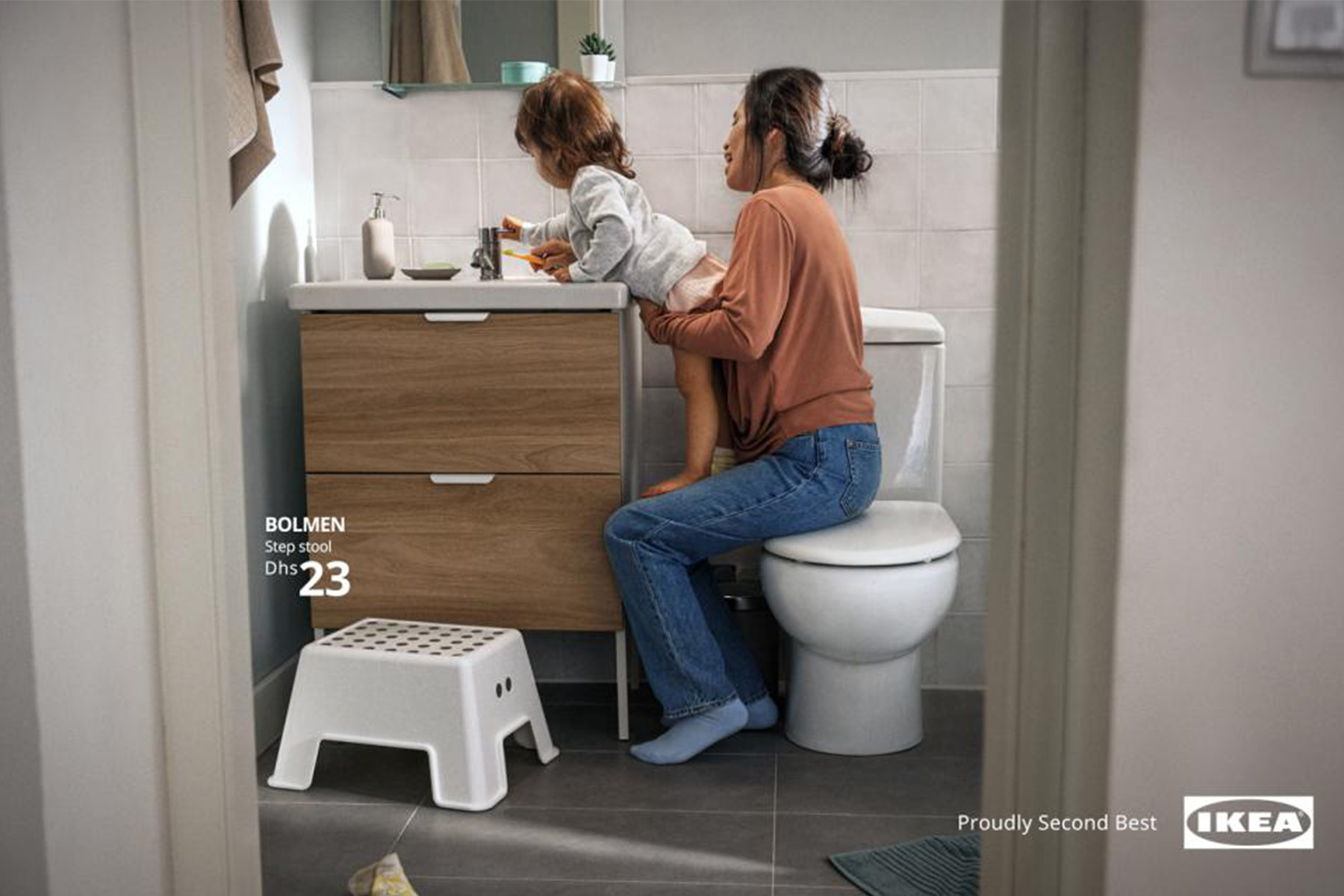 Mother helping child wash hands and IKEA BLUMEN step stool 