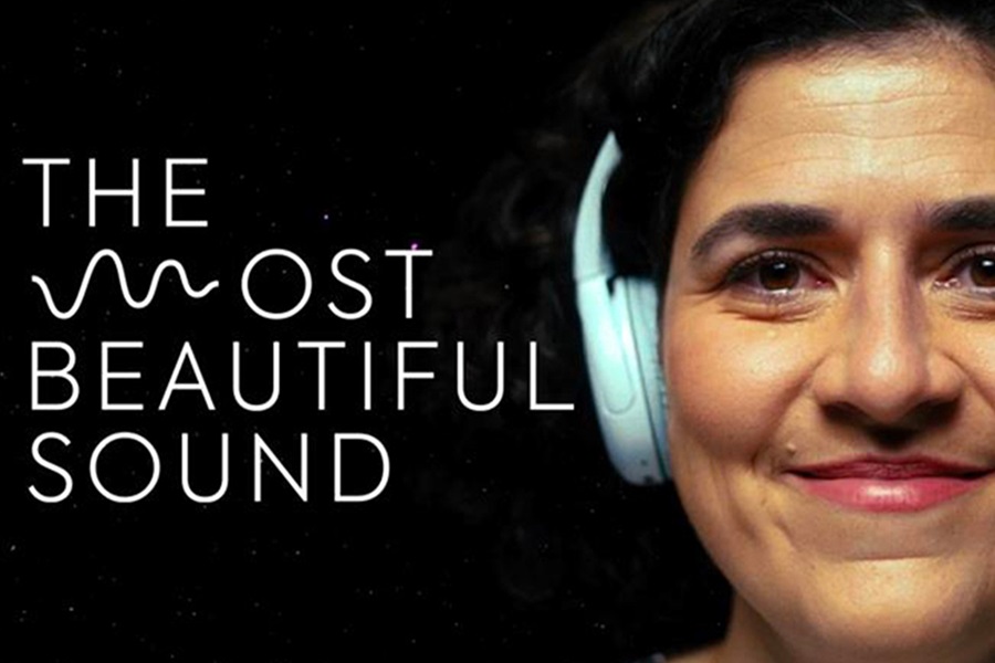 Black background with "The Most Beautiful Sound" text on the left side of the image and a person smiling with headphones on on the right