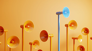 Orange and blue megaphones on an orange background