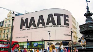Say maaate campaign on billboards in Piccadilly Circus with people and a red London bus in the foreground