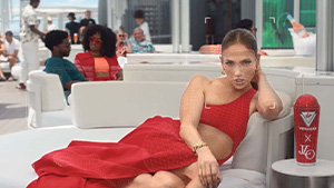AI generated image of Jennifer Lopez lying on an outdoor sofa