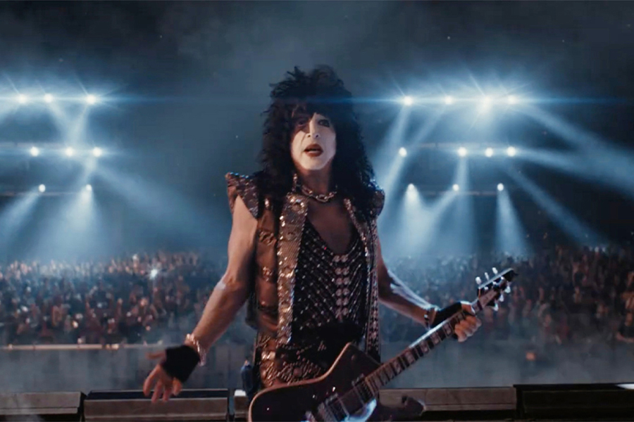 Image from workday super bowl ad of member of KISS on stage