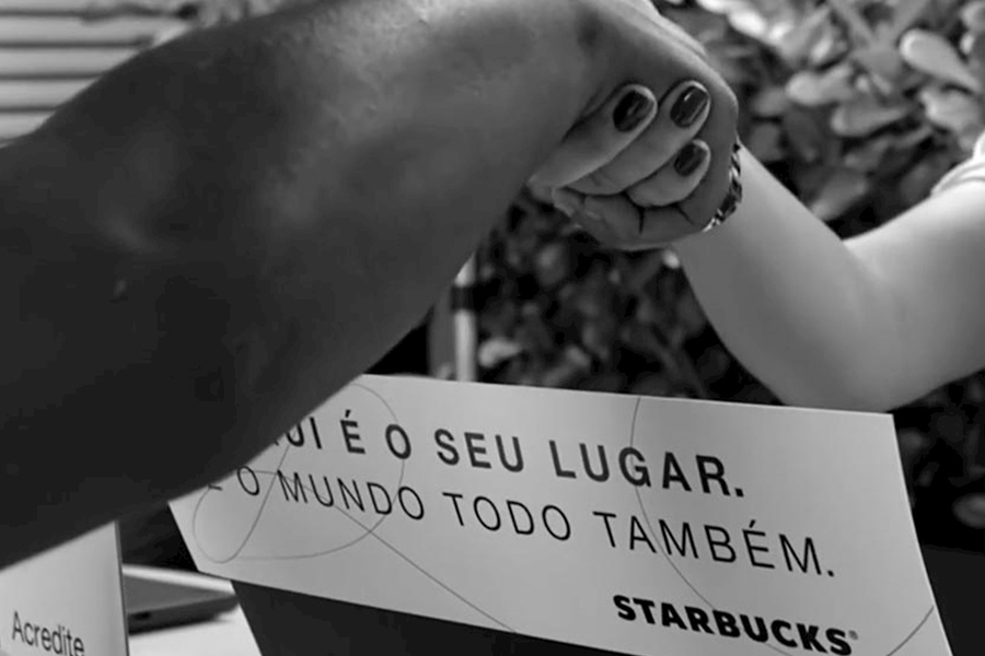 Starbucks I am campaign with image of two hands shaking