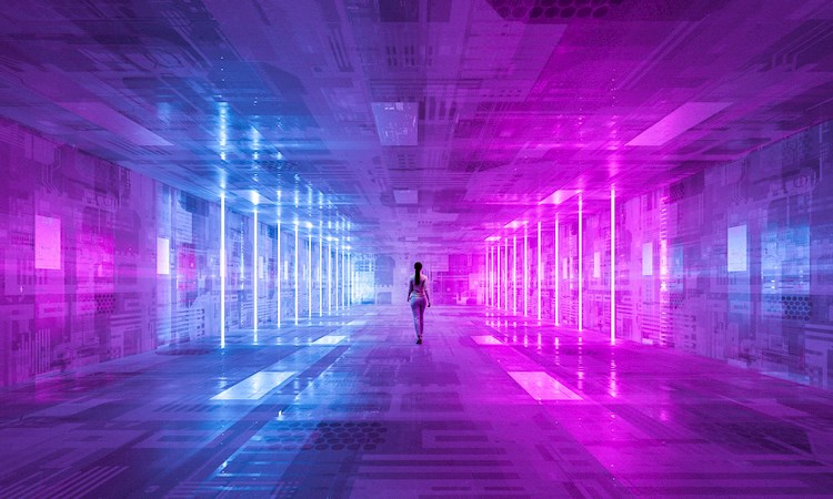 Businesswoman walking in futuristic illuminated dark corridor