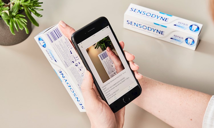 Image showing person using Microsoft Seeing AI app to view packaging 