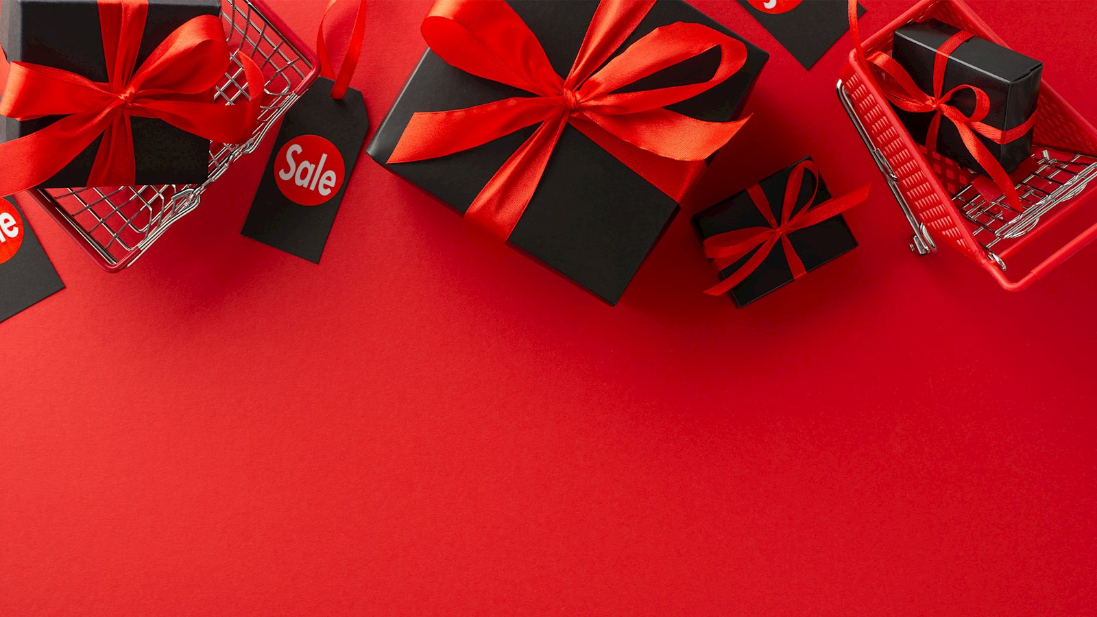 Presents and gifts with sale tags on red background
