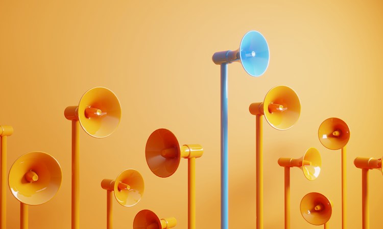 Orange and blue megaphones on an orange background