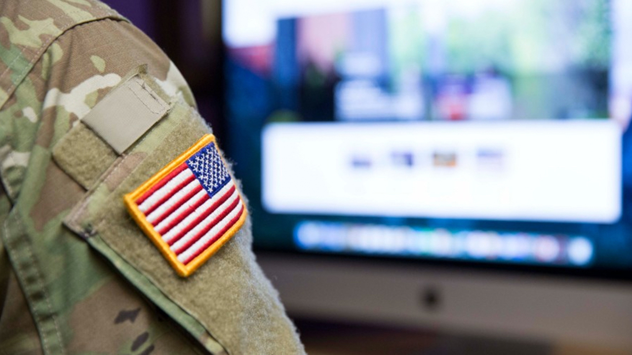 Arm of military uniform with US flag