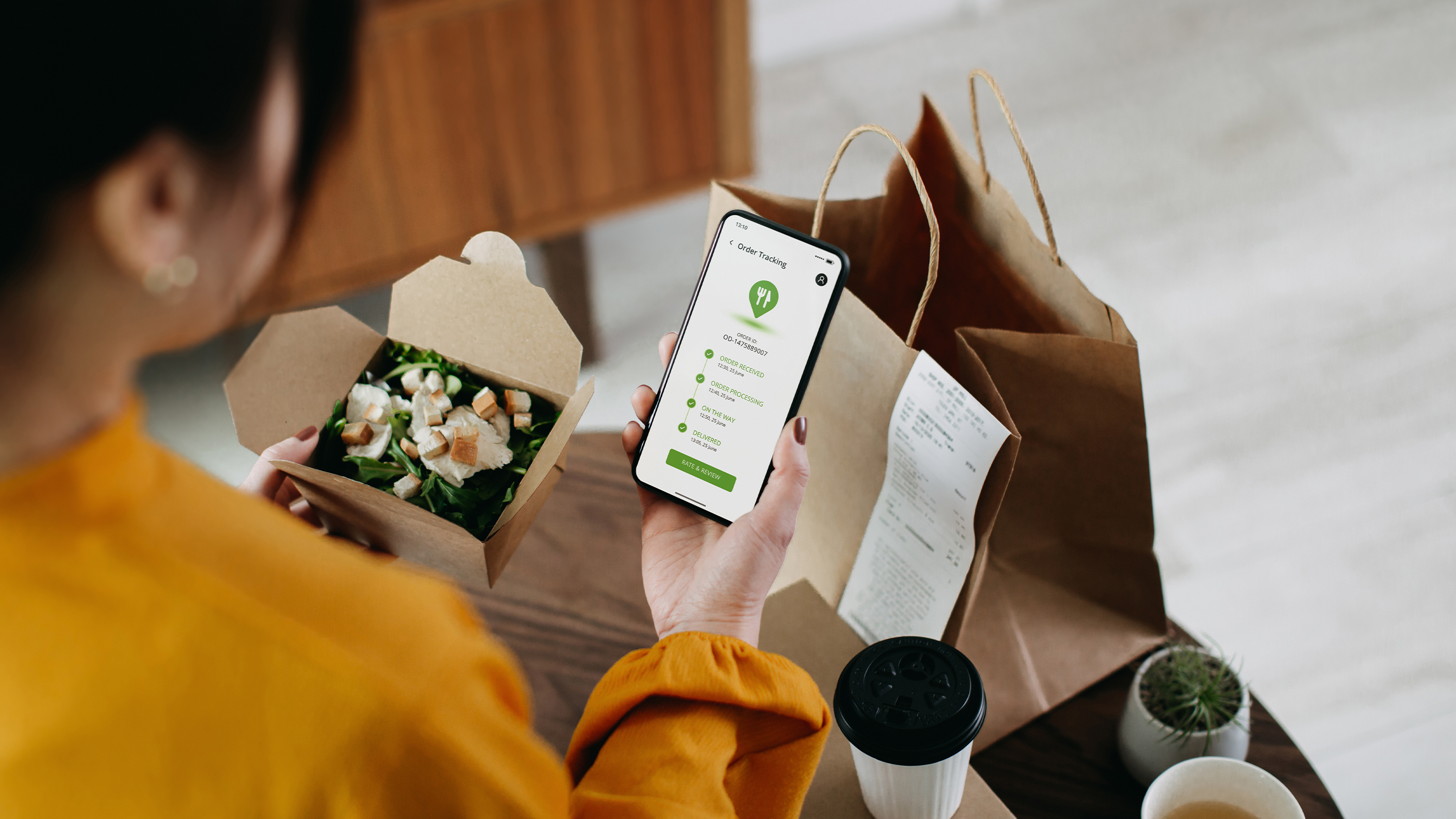 Woman ordering food via smart phone app